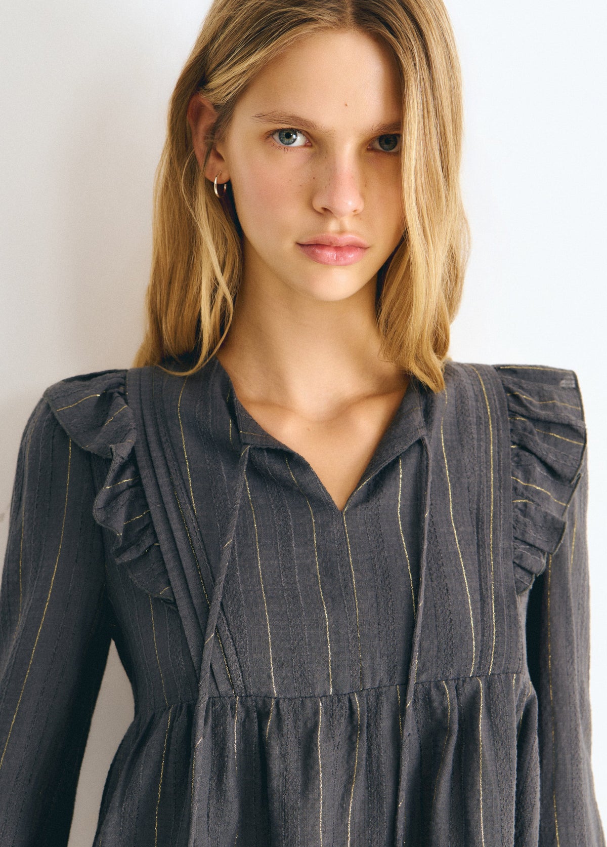 Blusa detalle volantes raya lurex