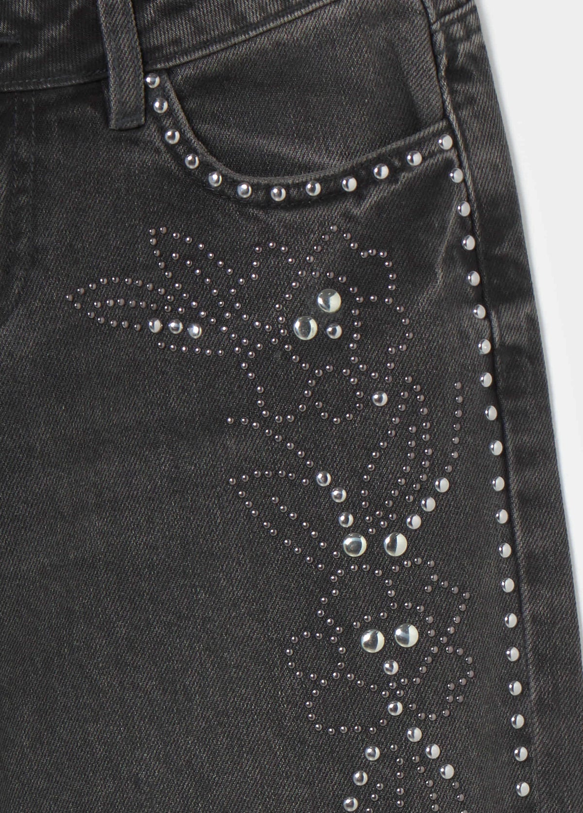 Jeans tiro bajo tachas flor