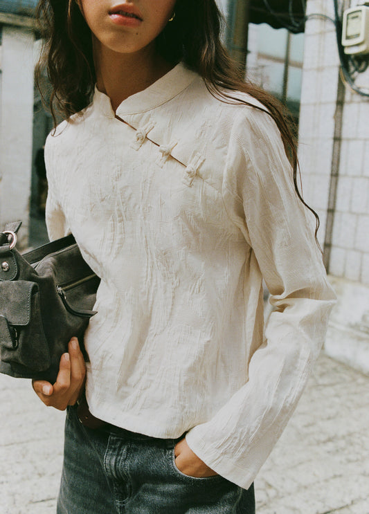 Blusa jacquard detalle botones
