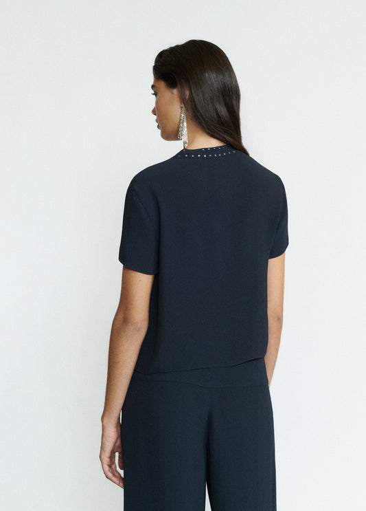 Blusa manga corta detalle tachas