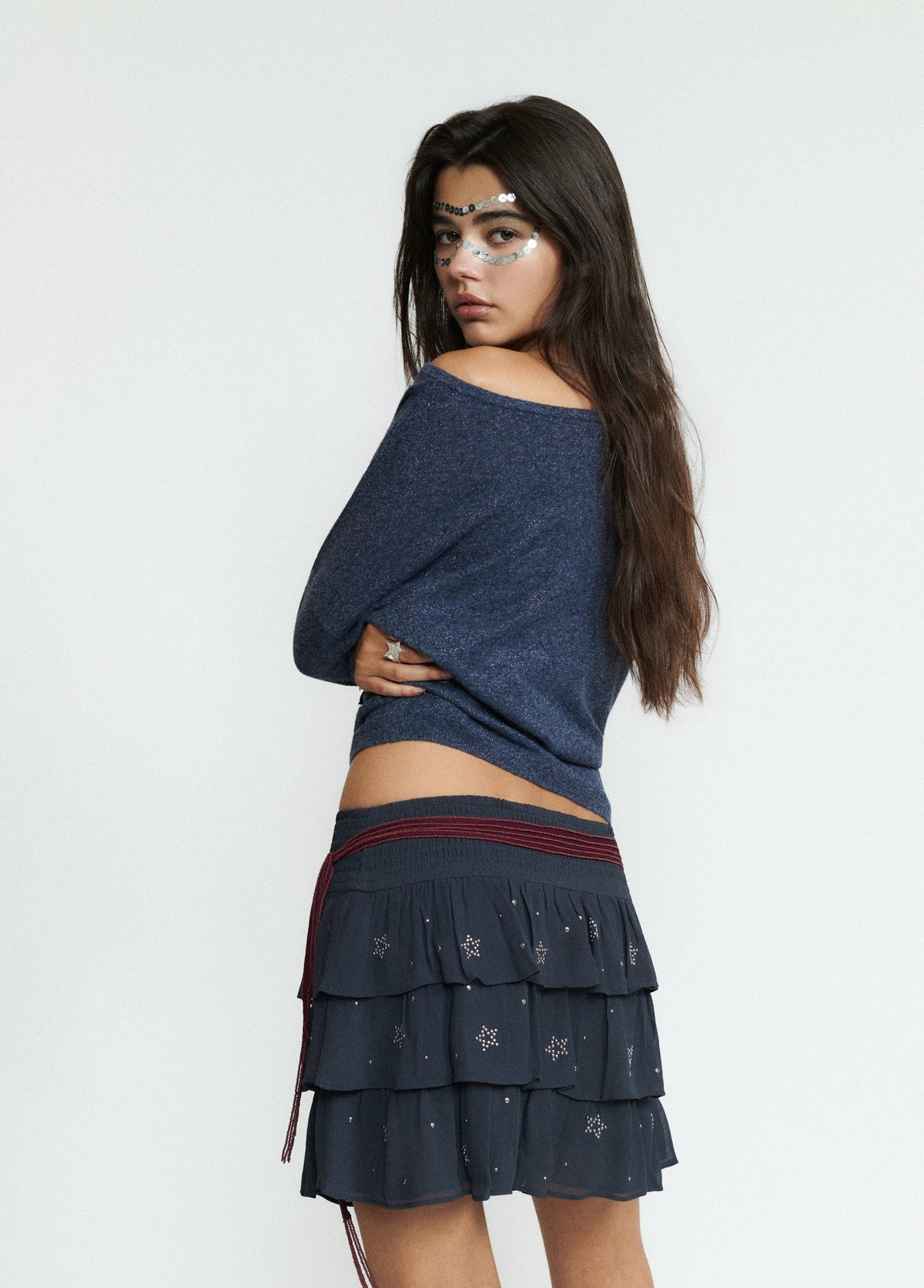 Falda corta multivolantes tachas