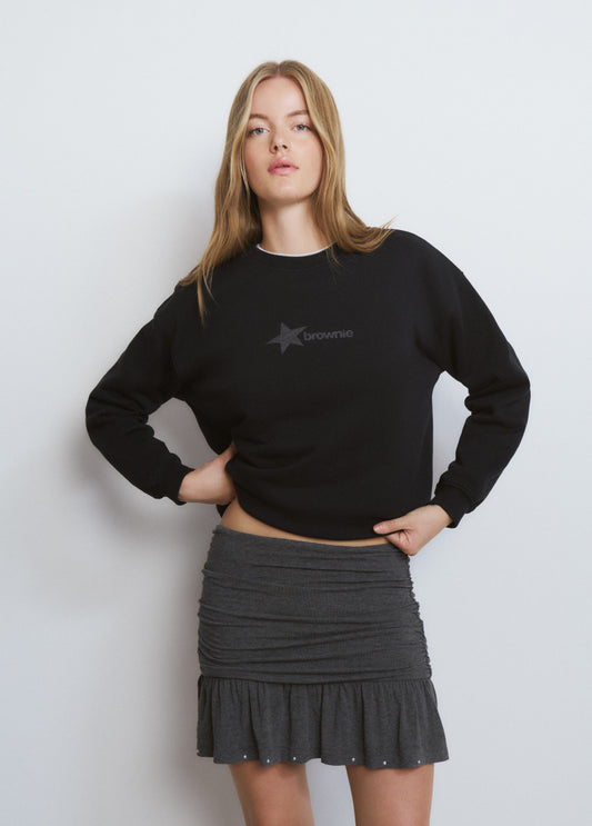 Falda corta pliegues