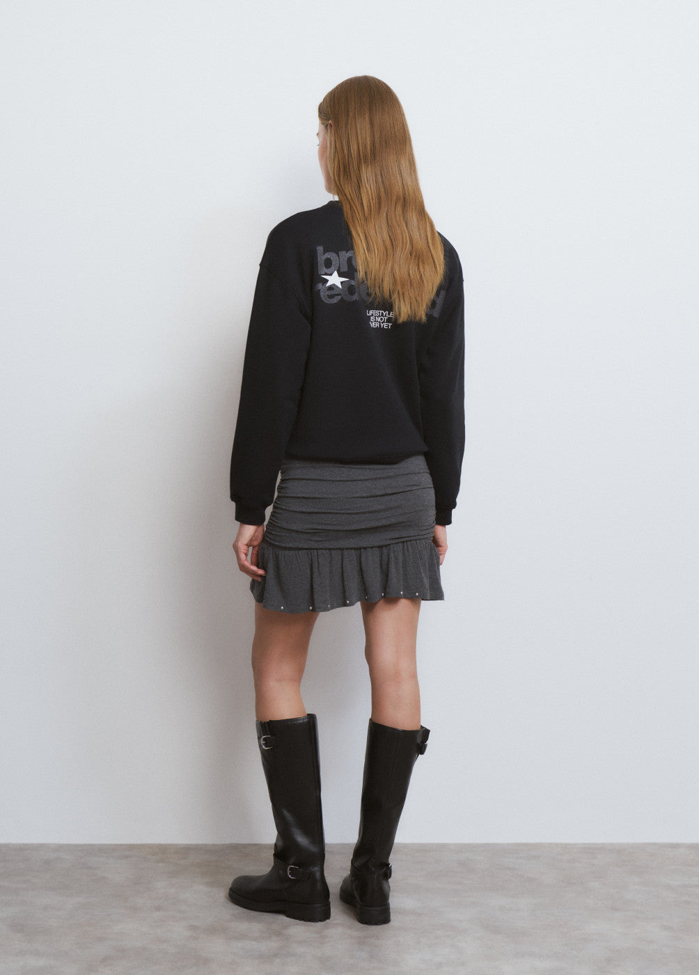 Falda corta pliegues