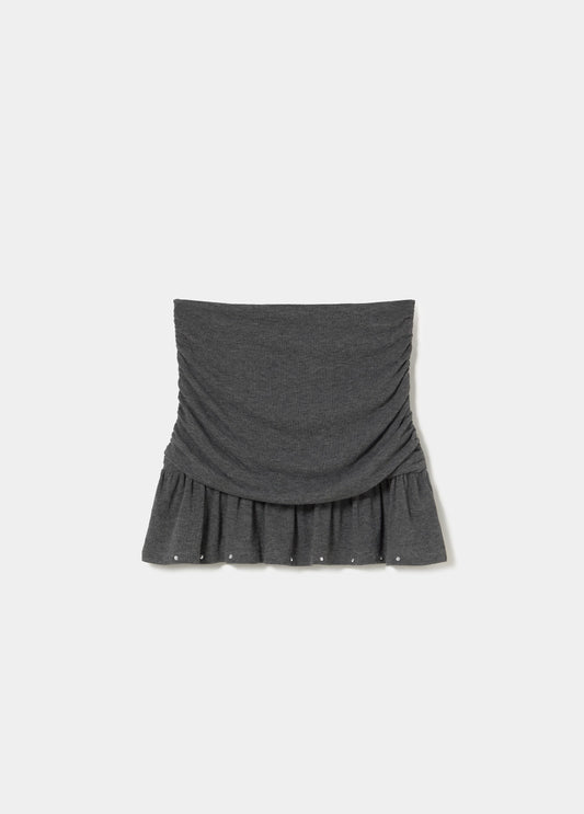 Falda corta pliegues