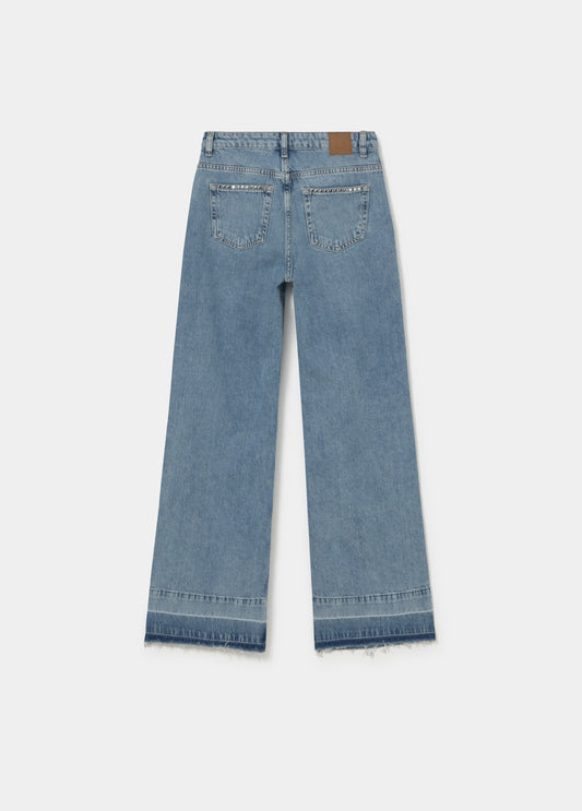 Jeans tachas bajo vuelta