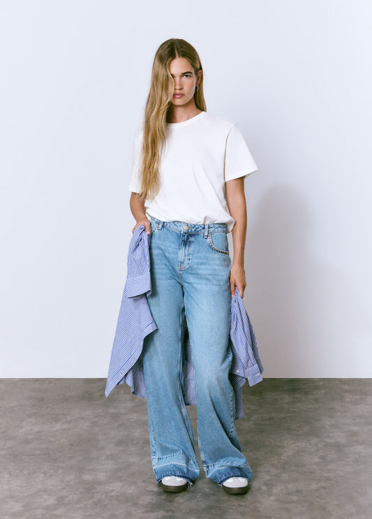 Jeans tachas bajo vuelta