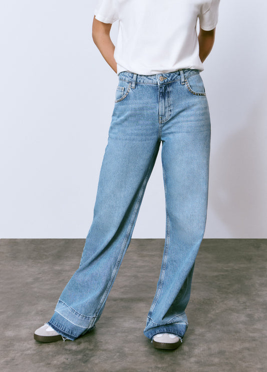 Jeans tachas bajo vuelta