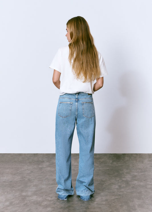 Jeans tachas bajo vuelta