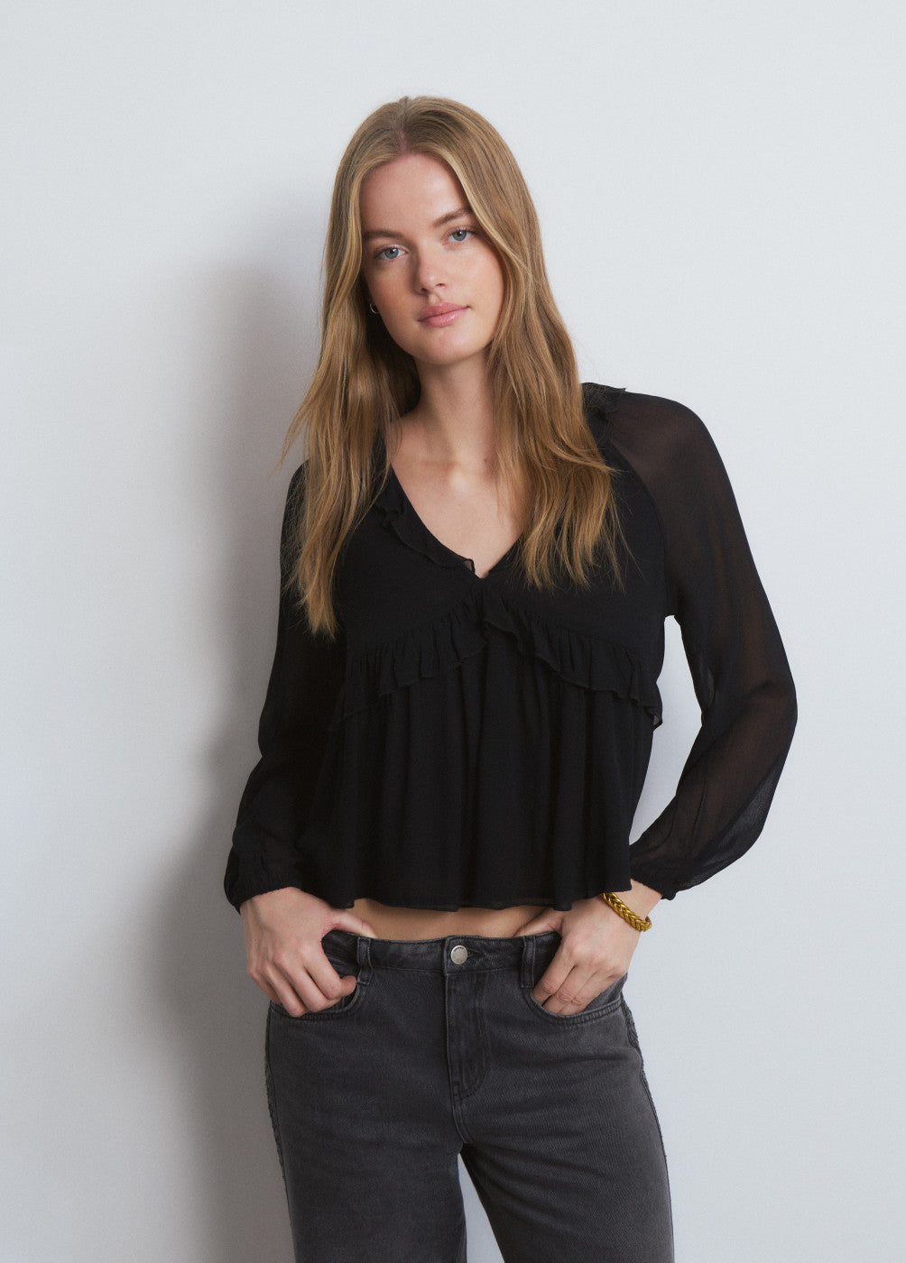 Blusa semitransparente eyelets