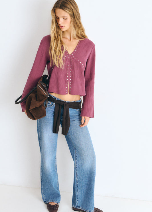 Blusa manga larga tachas