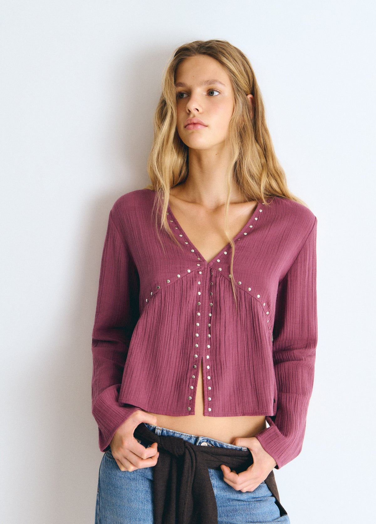 Blusa manga larga tachas