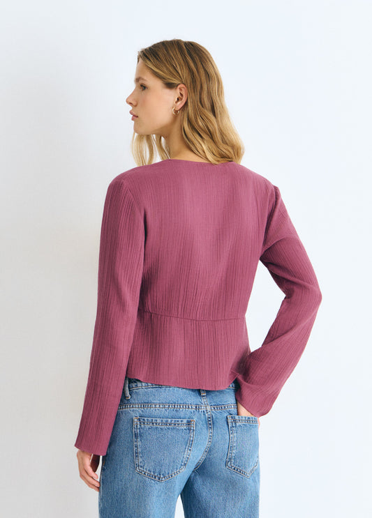 Blusa manga larga tachas