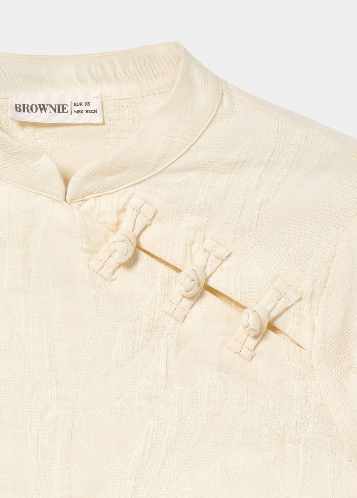 Blusa jacquard detalle botones