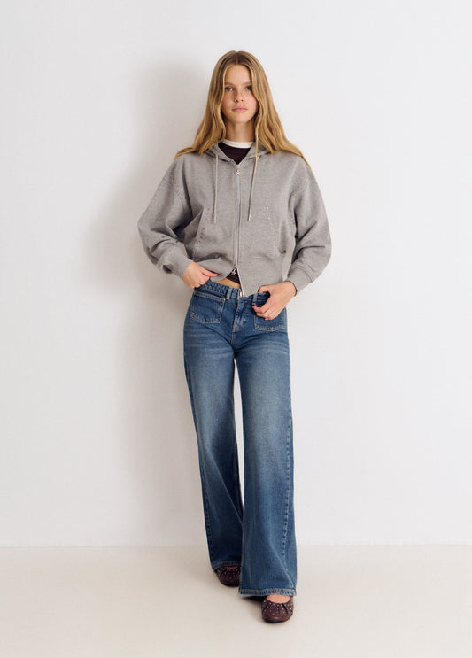 Jeans bolsillo frontal bordado