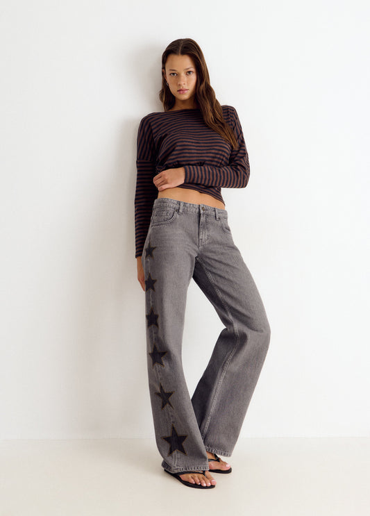 Jeans estrellas tachas lateral