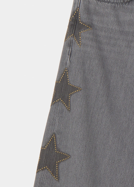 Jeans estrellas tachas lateral
