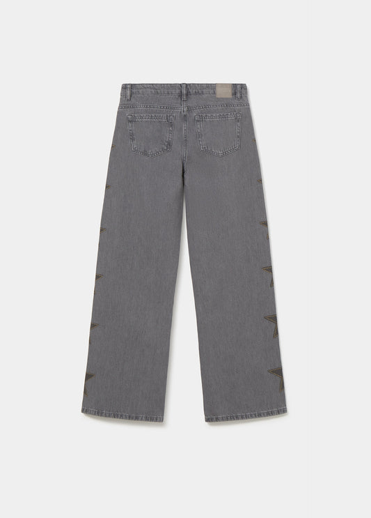 Jeans estrellas tachas lateral