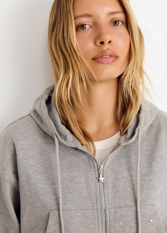 Sudadera capucha tachas