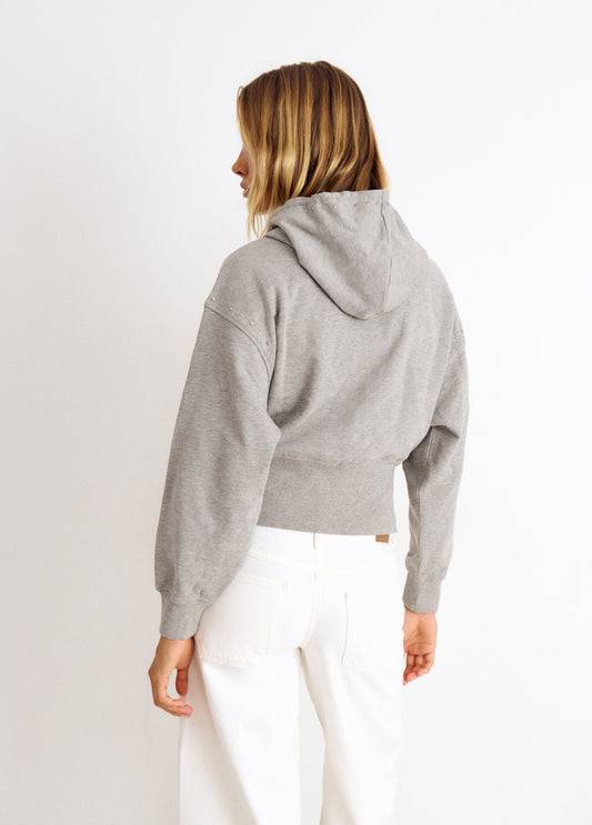 Sudadera capucha tachas