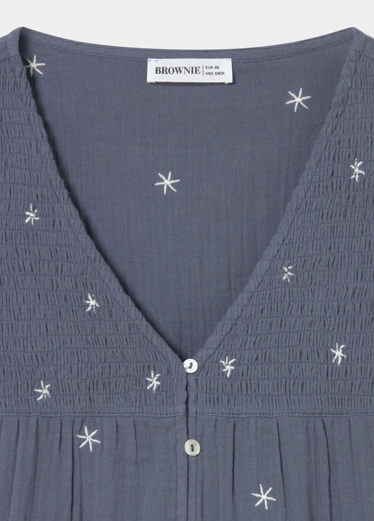 Blusa manga larga dobby escote pico