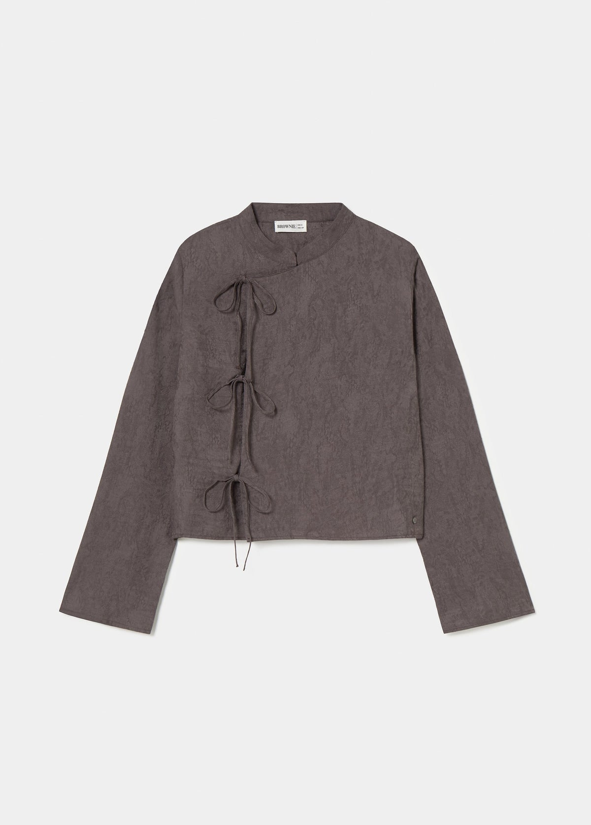 Blusa jacquard detalle lazos