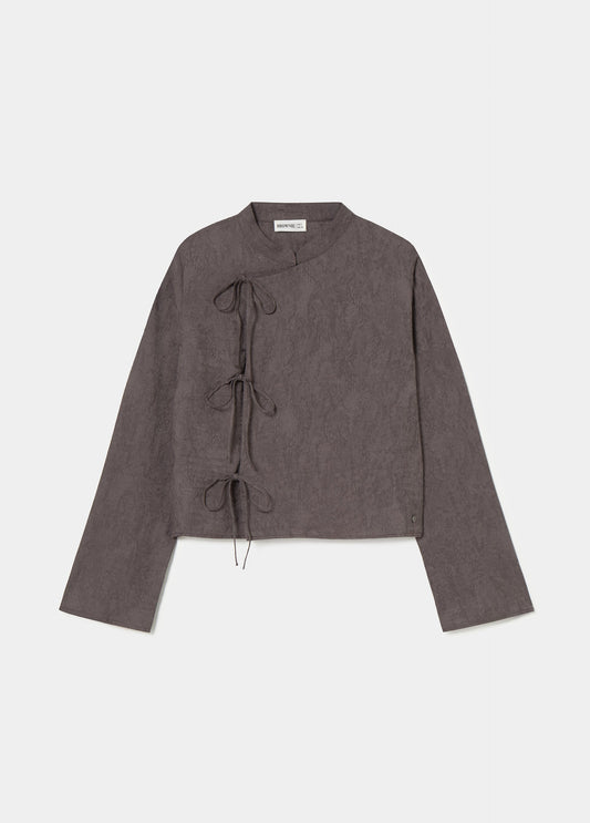 Blusa jacquard detalle lazos