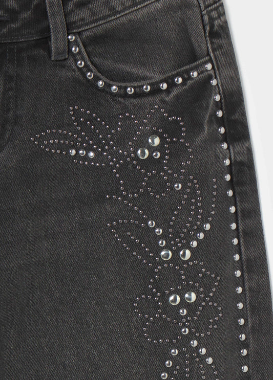 Jeans tiro bajo tachas flor
