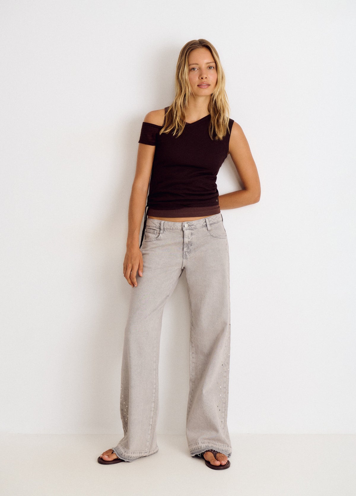 Jeans tachas laterales