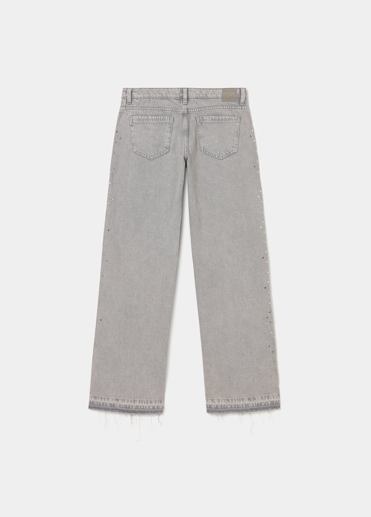 Jeans tachas laterales