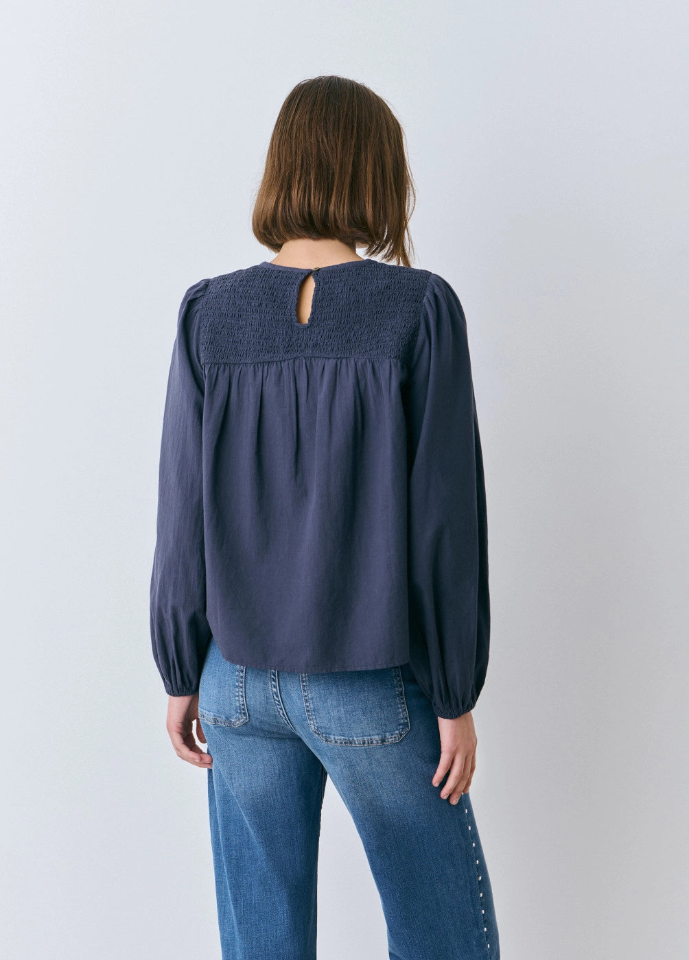 Blusa goma escote apertura