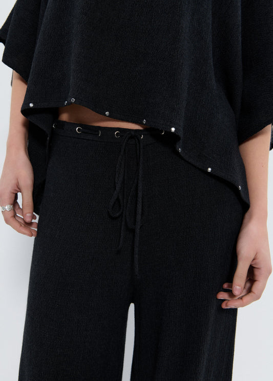 Capa detalle tachas y bufanda