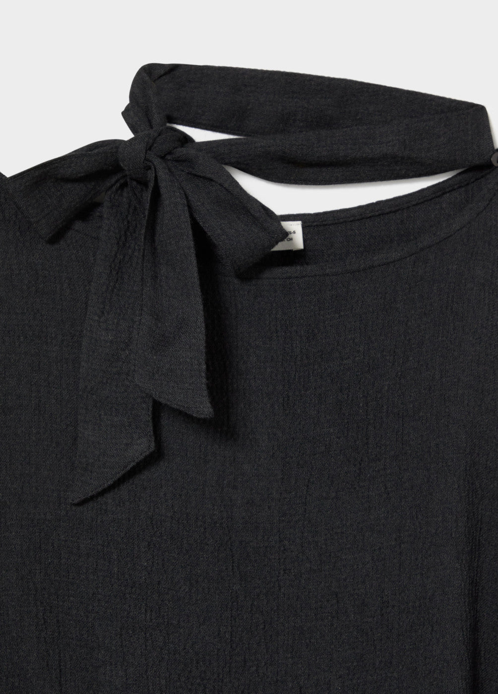 Capa detalle tachas y bufanda