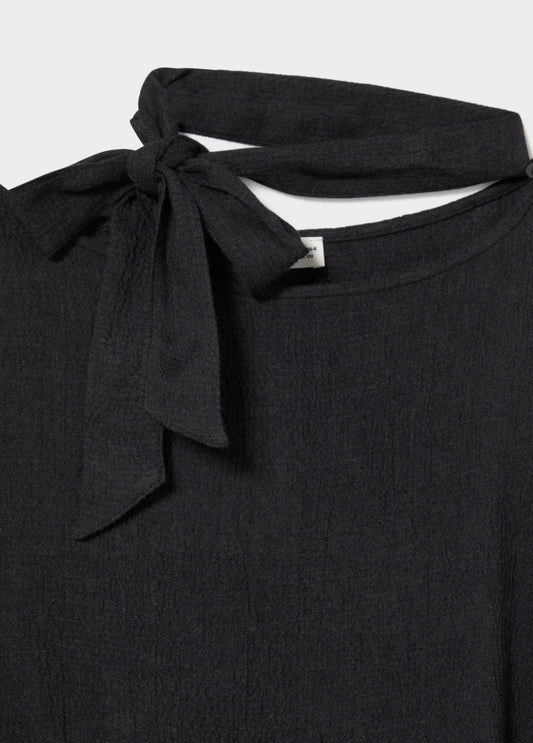 Capa detalle tachas y bufanda