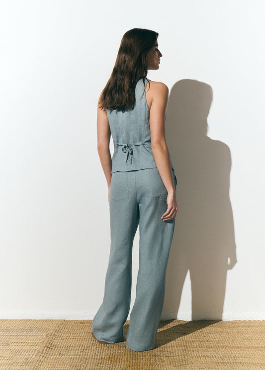 Pantalón fluido bolsillo parche